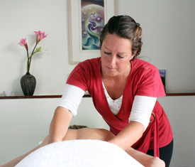 Photo of Katie Trenary providing a professional massage